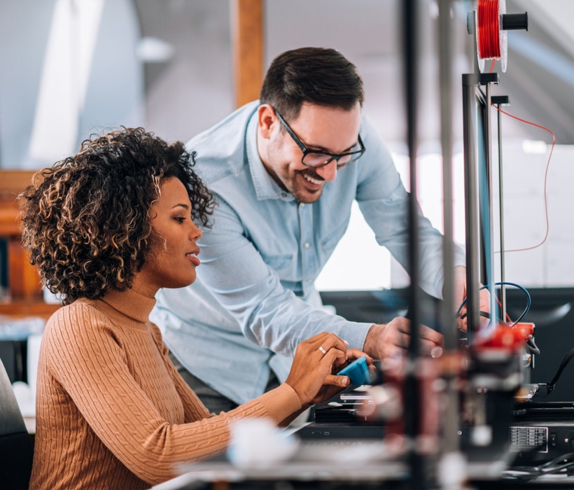 co-workers creating on a 3d printer